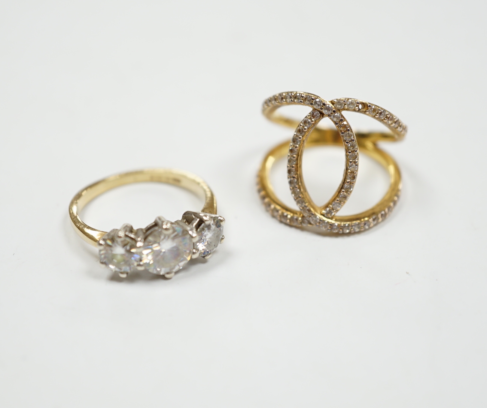 A 9ct gold and three stone simulated diamond ring and a gilt 925 ring.